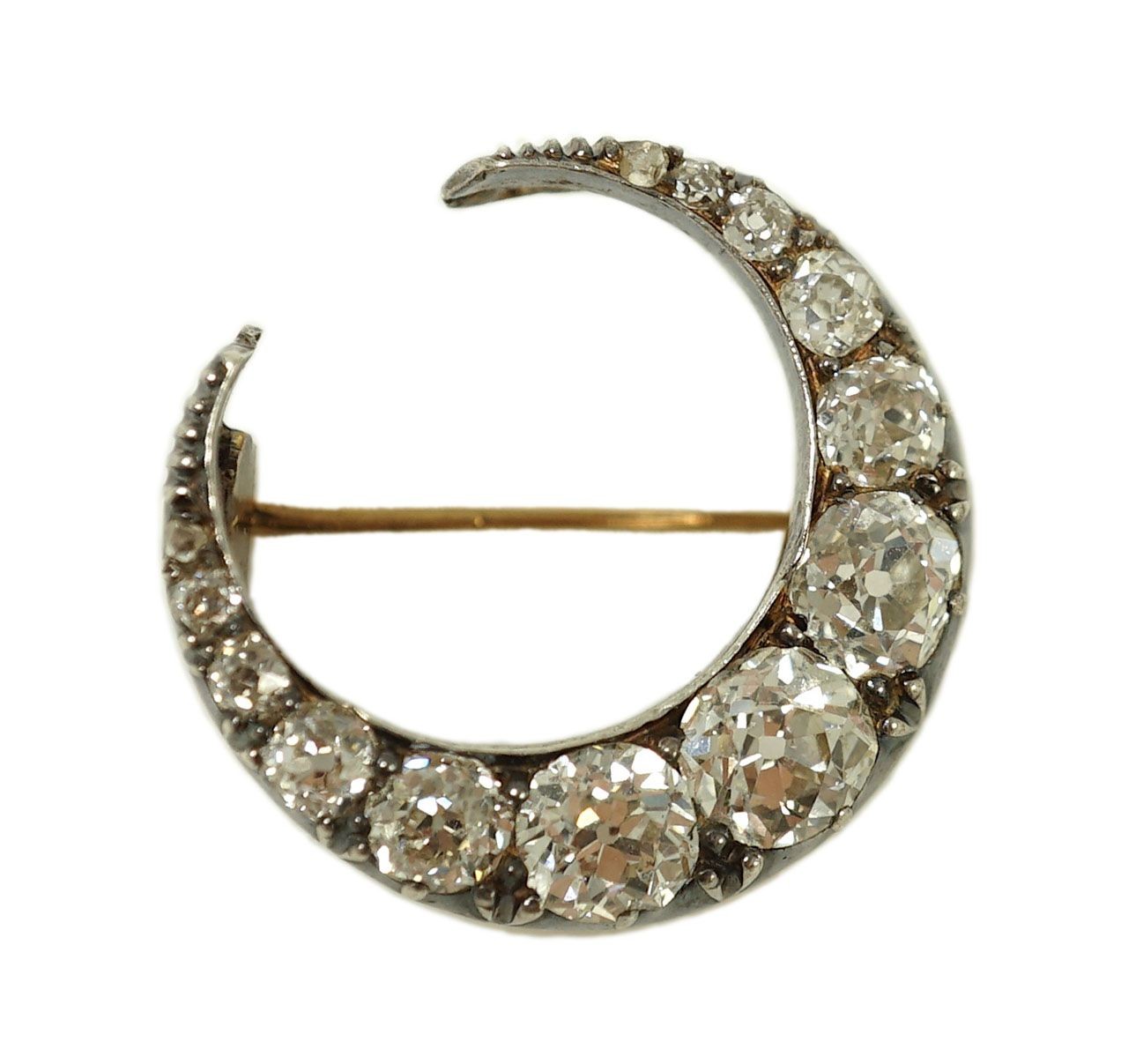 A Victorian gold, silver and graduated thirteen stone diamond set crescent brooch